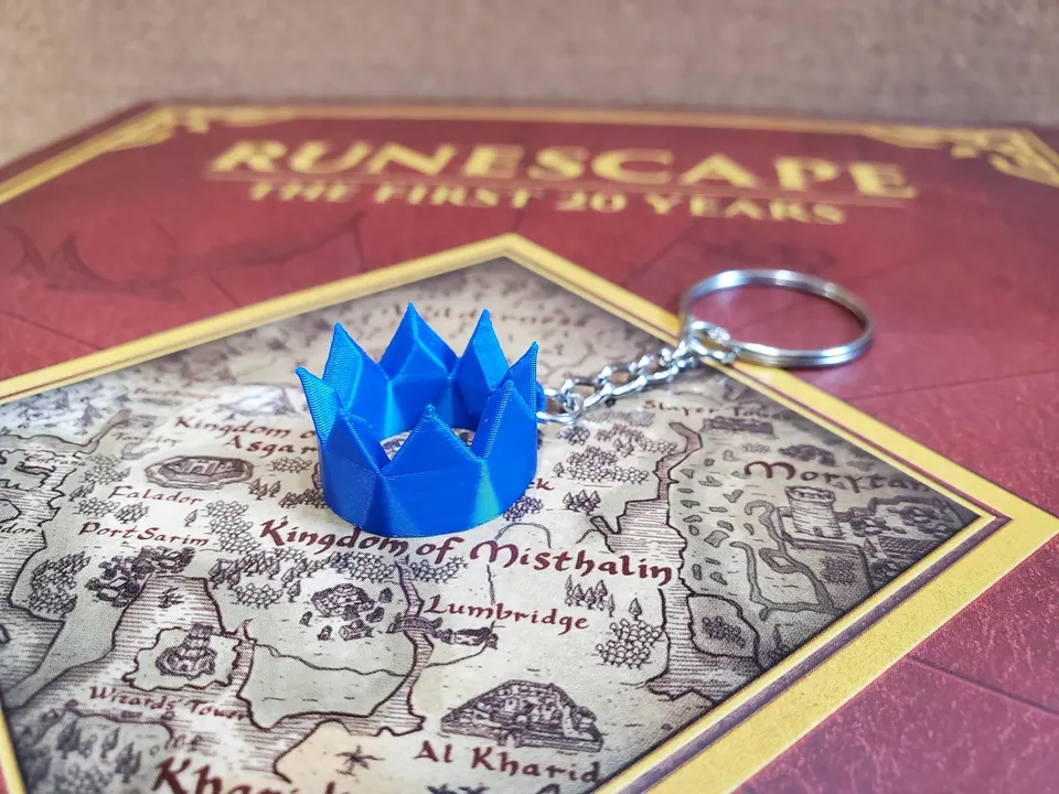 Blue party hat keychain on a RuneScape map